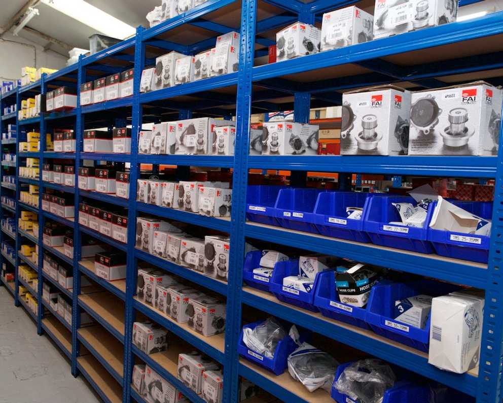 Blue shelving with boxes and containers